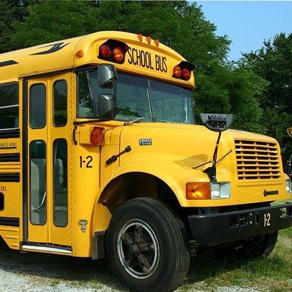 Front passenger side of yellow school bus