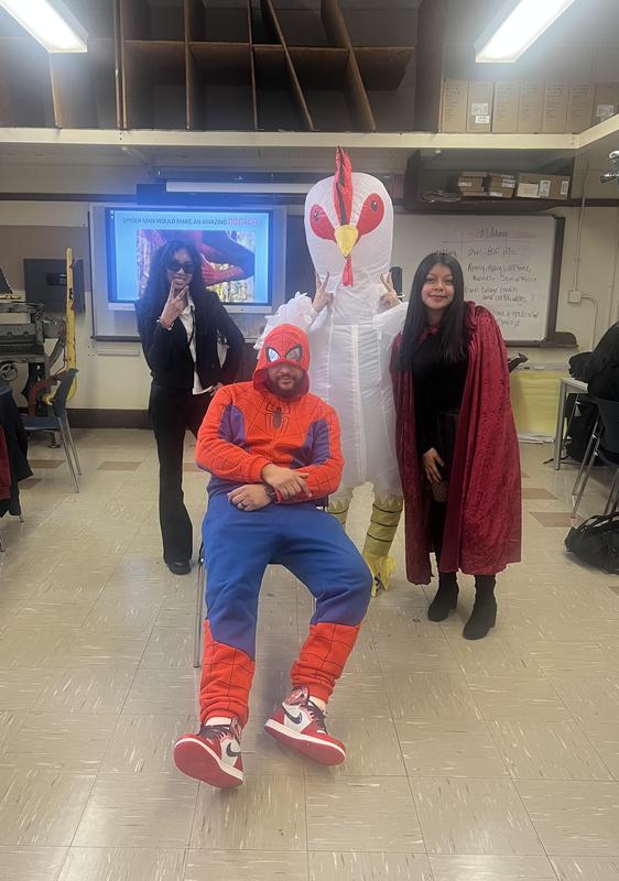 Students and staff dressed in costume for Halloween.
