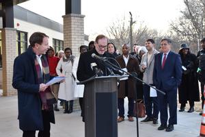 dennis bossick and ed donovan Speaking at podium