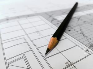 A pencil sitting on an architectural drawing