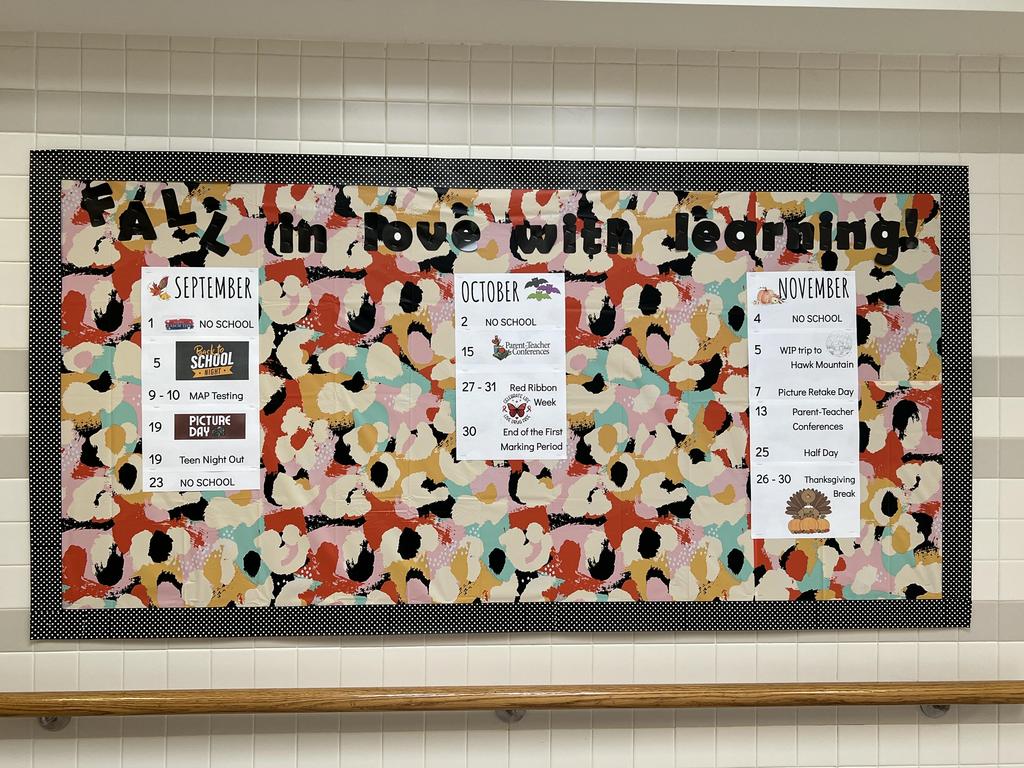 The "Fall In Love With Learning!" bulletin board in the school hallway.