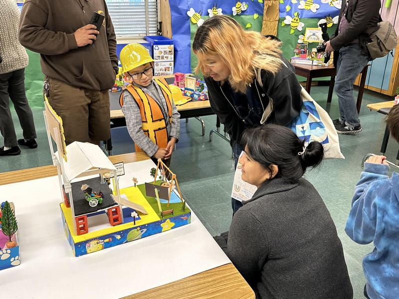 Kinder student presenting to parents