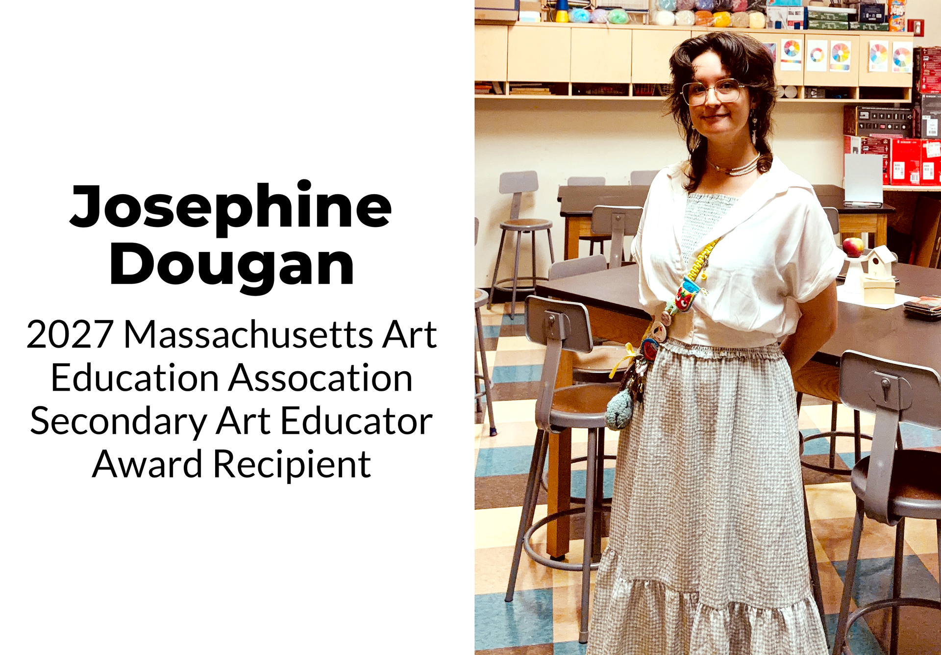 Young woman in a classroom, posing next to text about an award.
