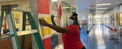 Students working on Christmas door decorations