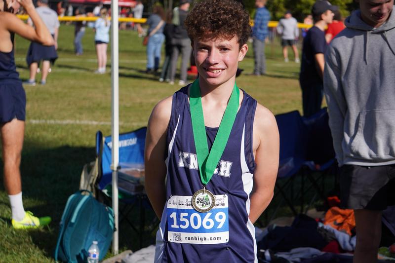 pic of a runner with a medal around his neck