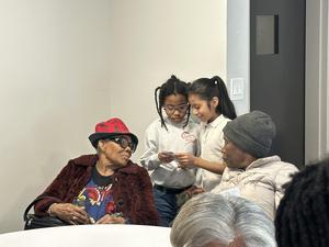 Students reading and sharing their research