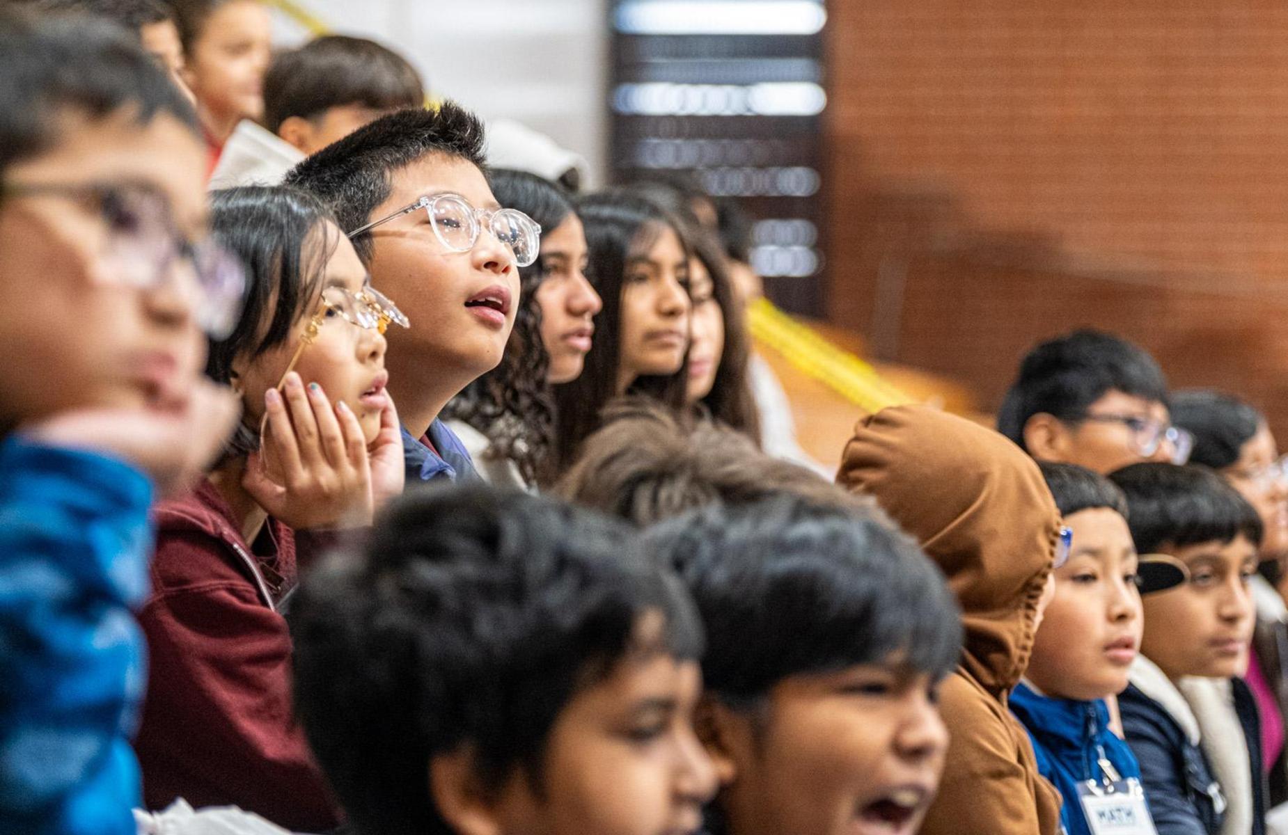 students engaged with their teacher