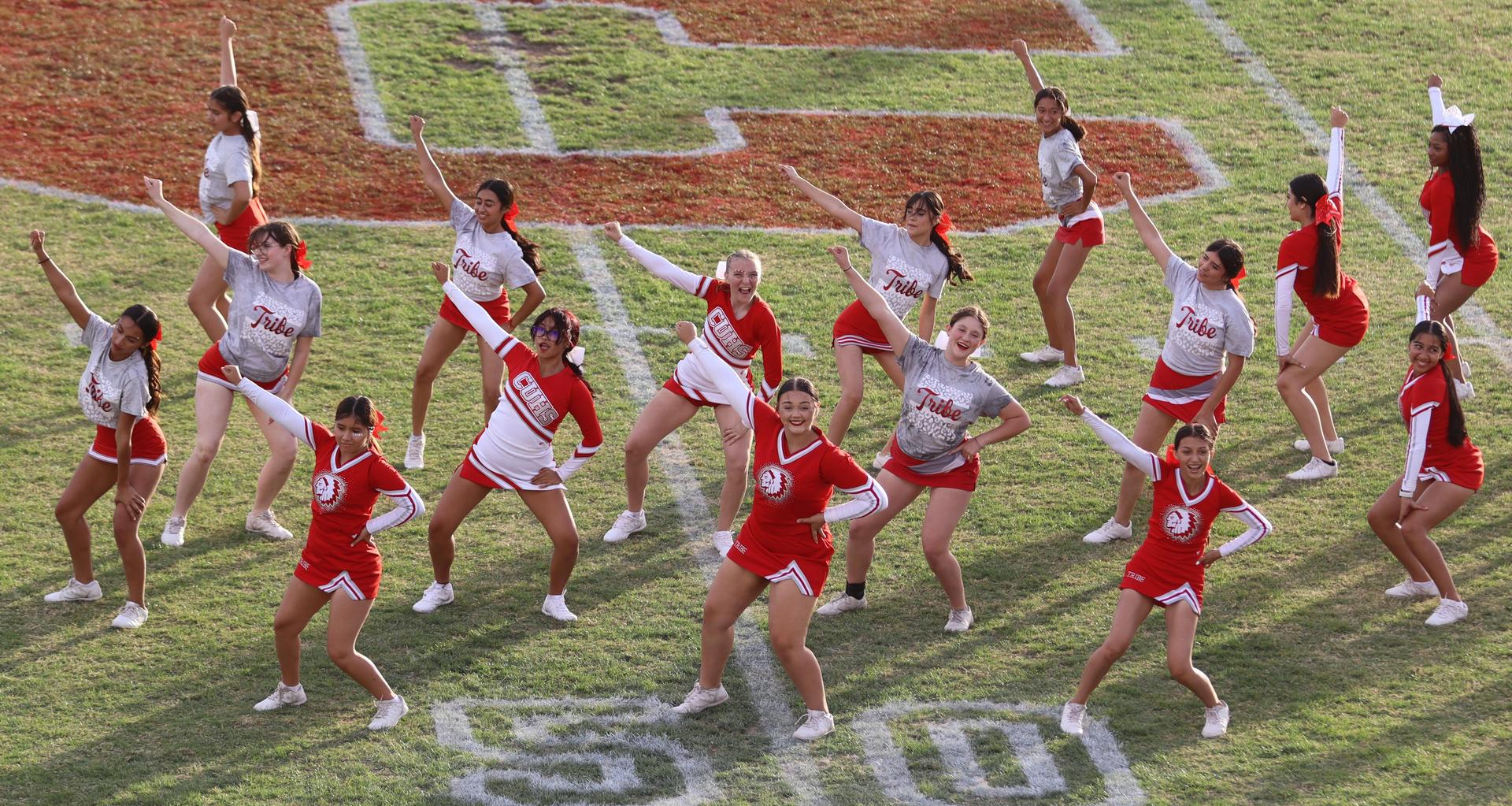 Combined cheer performing at halftime of the football game