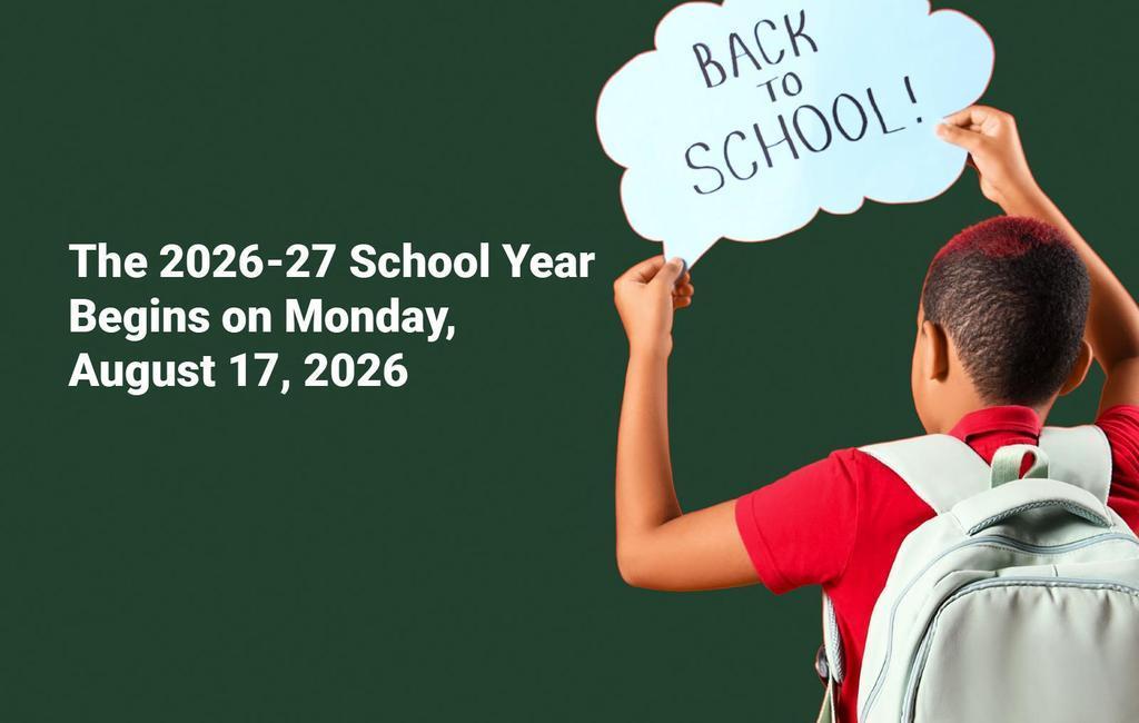 Student with a backpack holding the Back to School sign