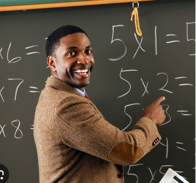 teacher at chalkboard