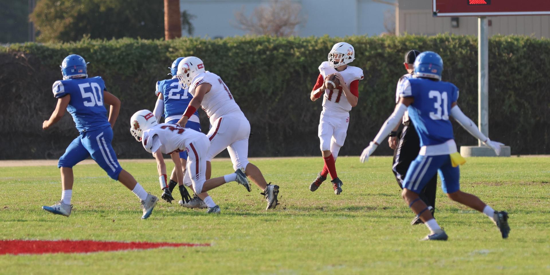 Junior Varsity football players in action against Caruthers