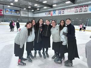 The girls ice skating