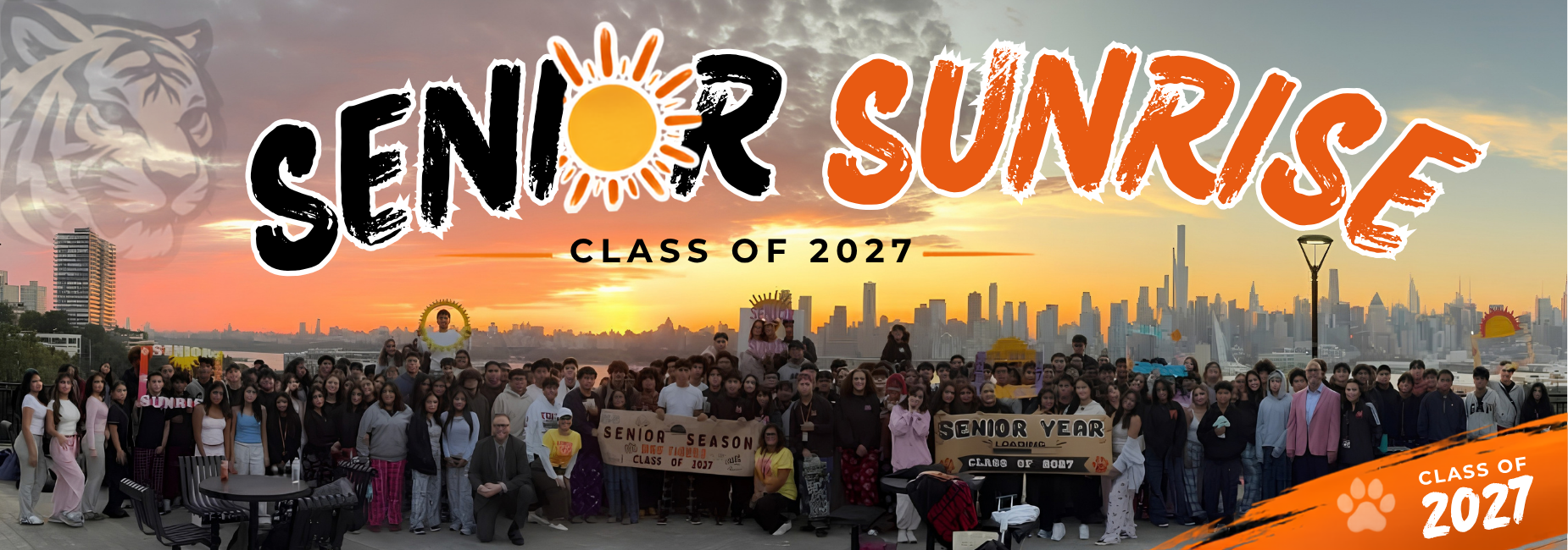 Group of students celebrating Senior Sunrise with a city skyline backdrop.