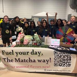 group of students at the display table