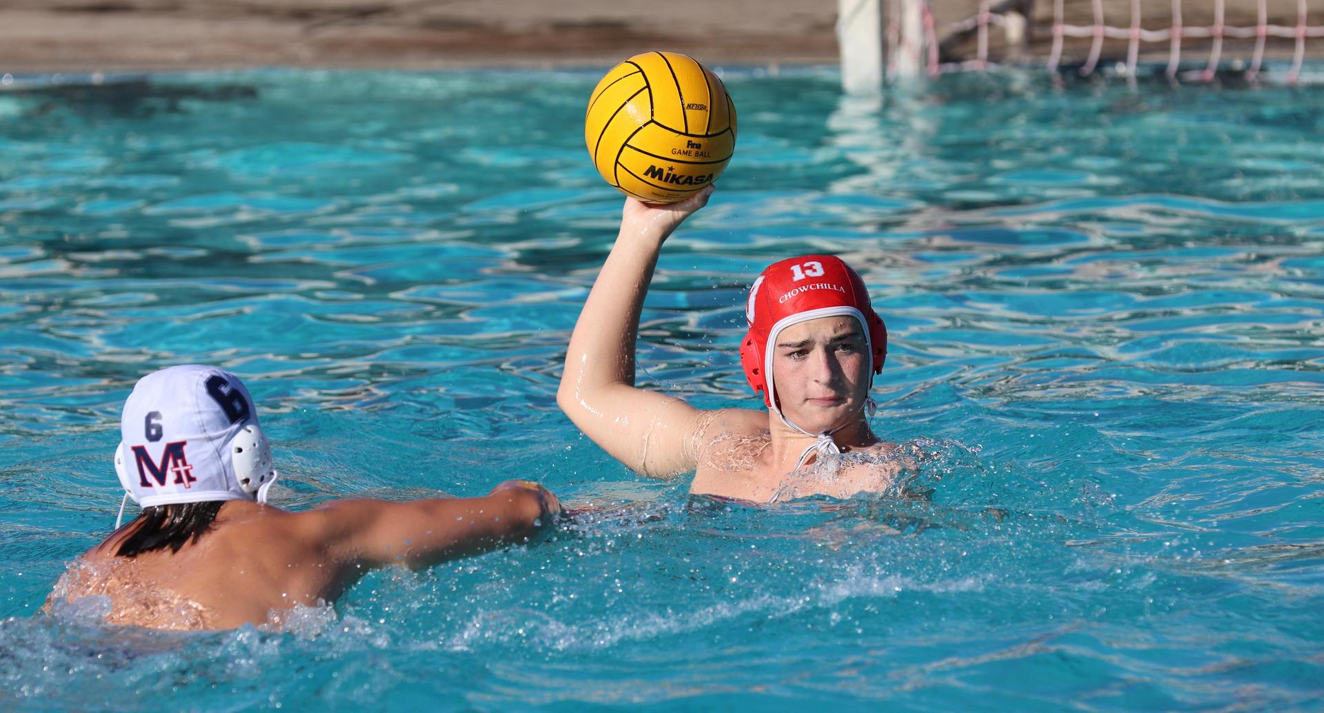 boys water polo players in action against san joaquin memorial