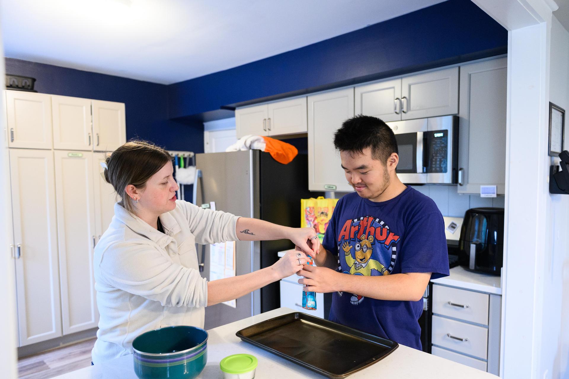 teacher assisting student