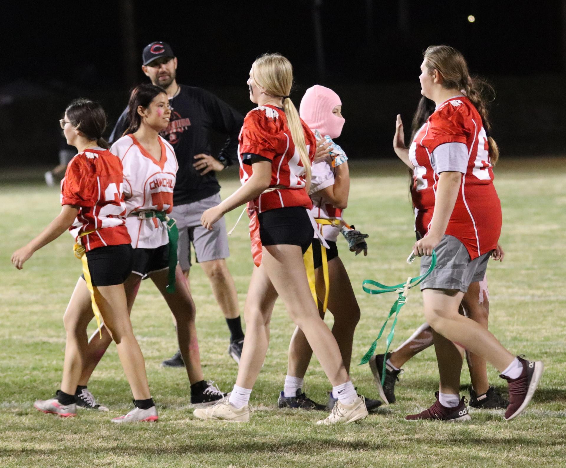 students shaking hands after the game