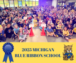 Picture of students sitting on the floor.