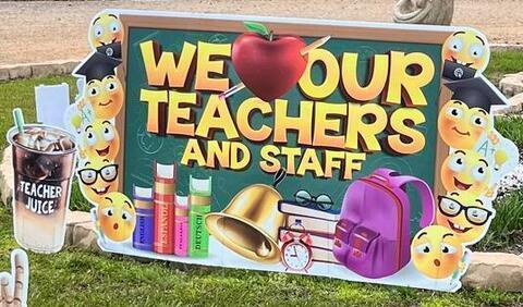 sign saying loves the staff and teachers