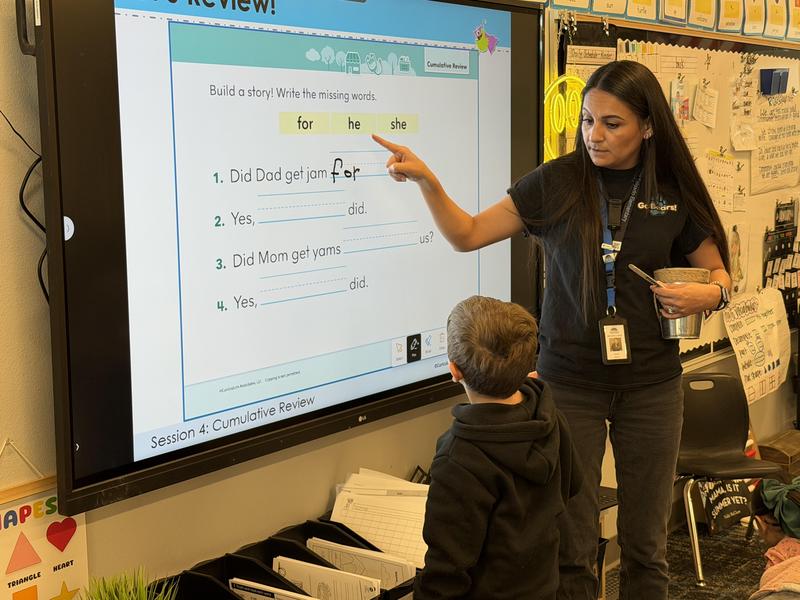 teacher and student using an LG smartboard