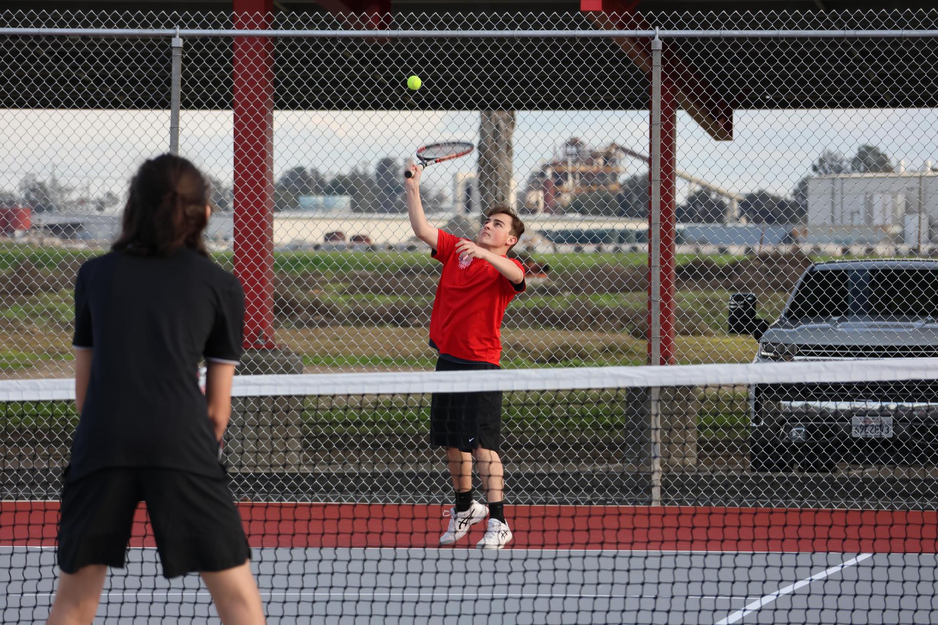 CUHS Boys playing tennis against coalinga