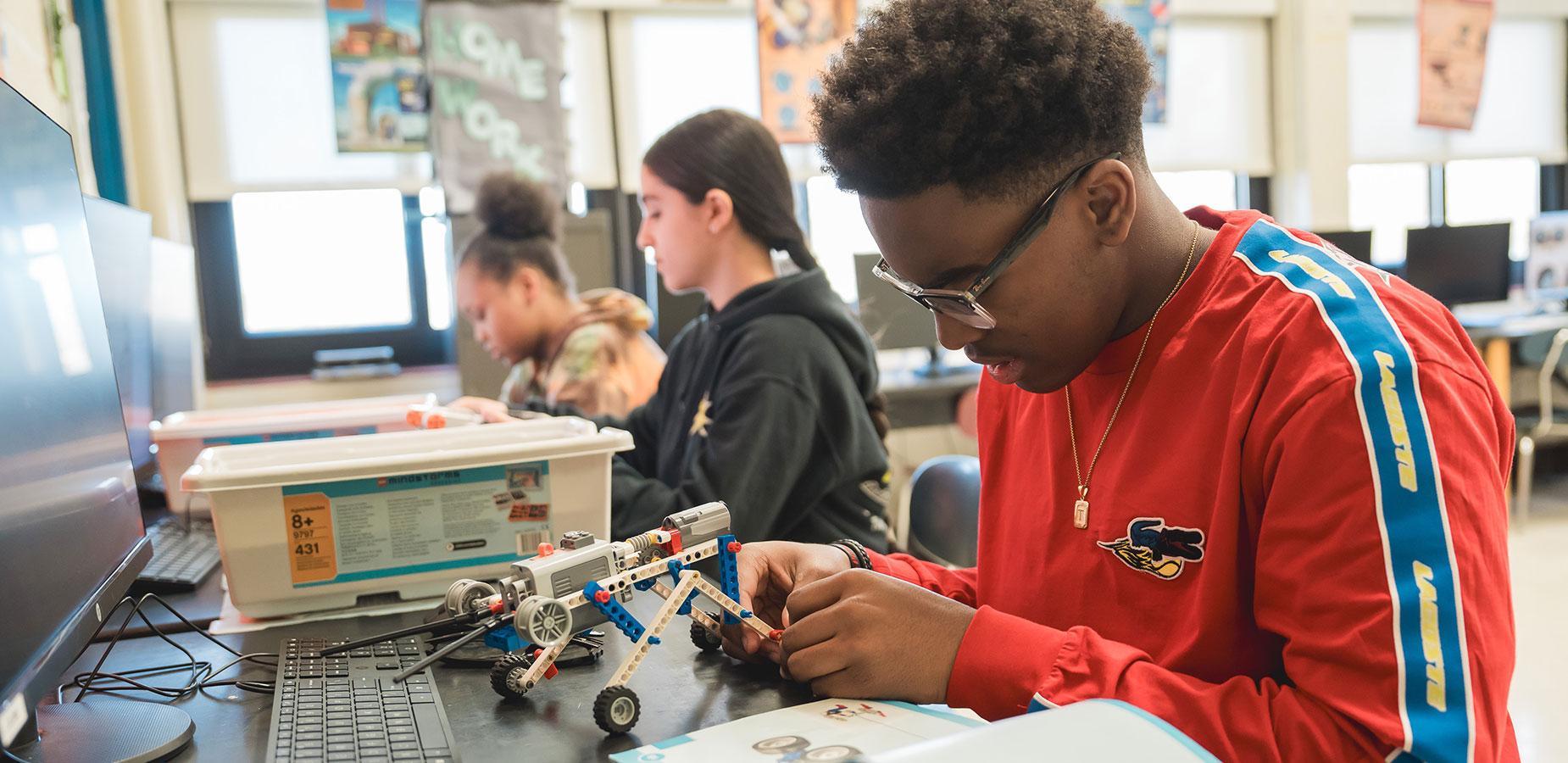 student working with LEGO stem activity