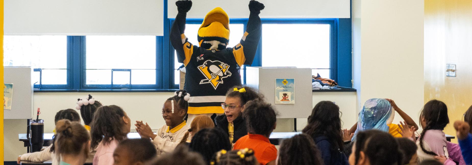 Students react to Iceburgh's antics during a visit to the school