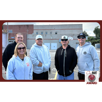 A photo of 5 PE teachers outdoors
