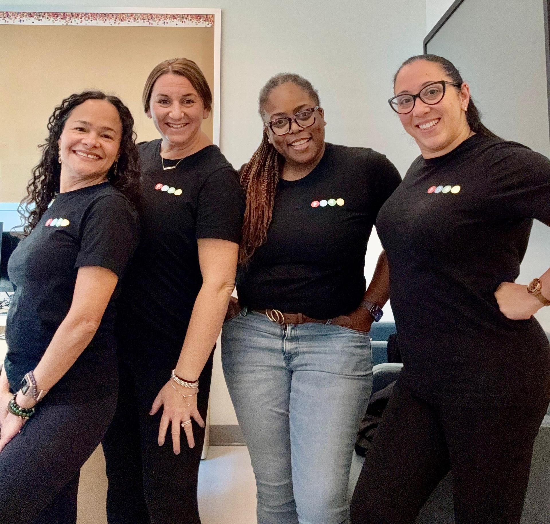 4 women with black shirts