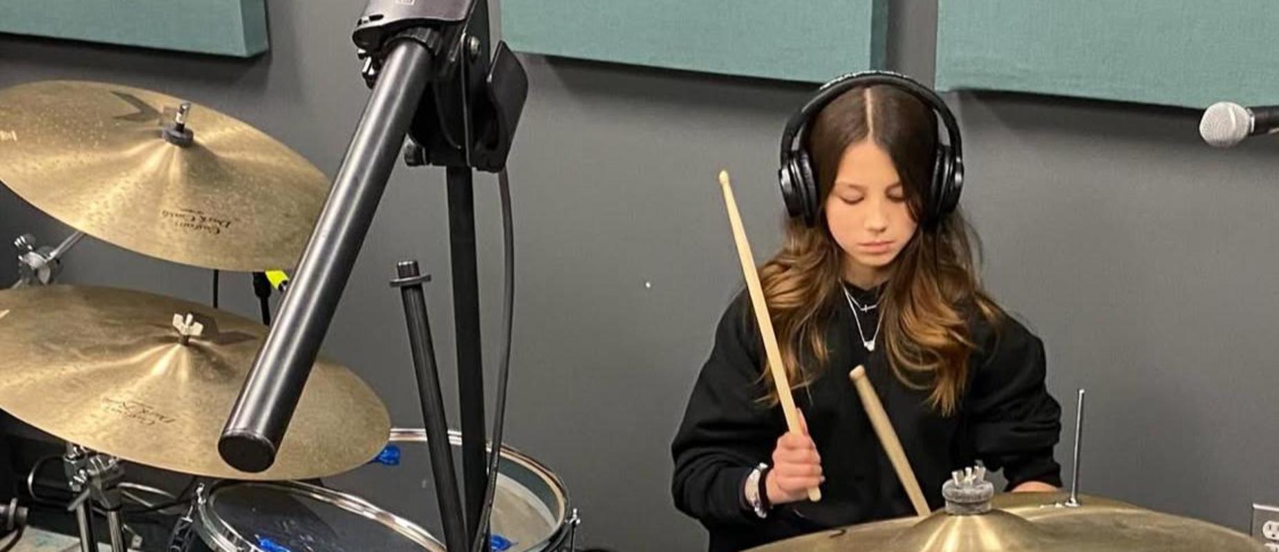 girl playing the drums
