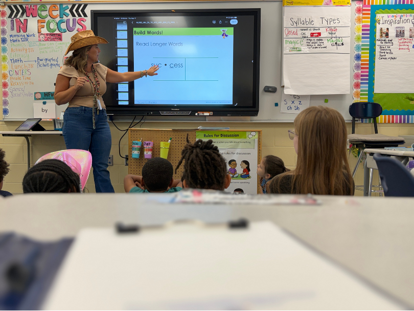 First grade teacher at the board