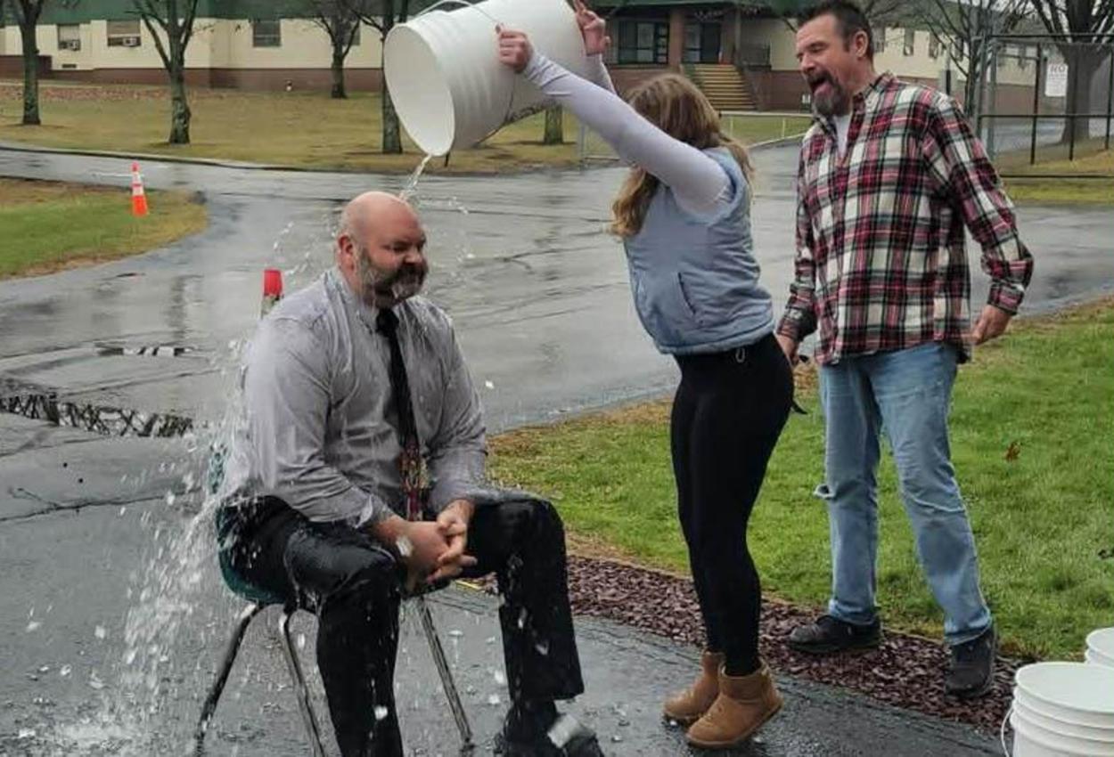 Principal Mr. Sullivan gets a bucket of water dumped on his head