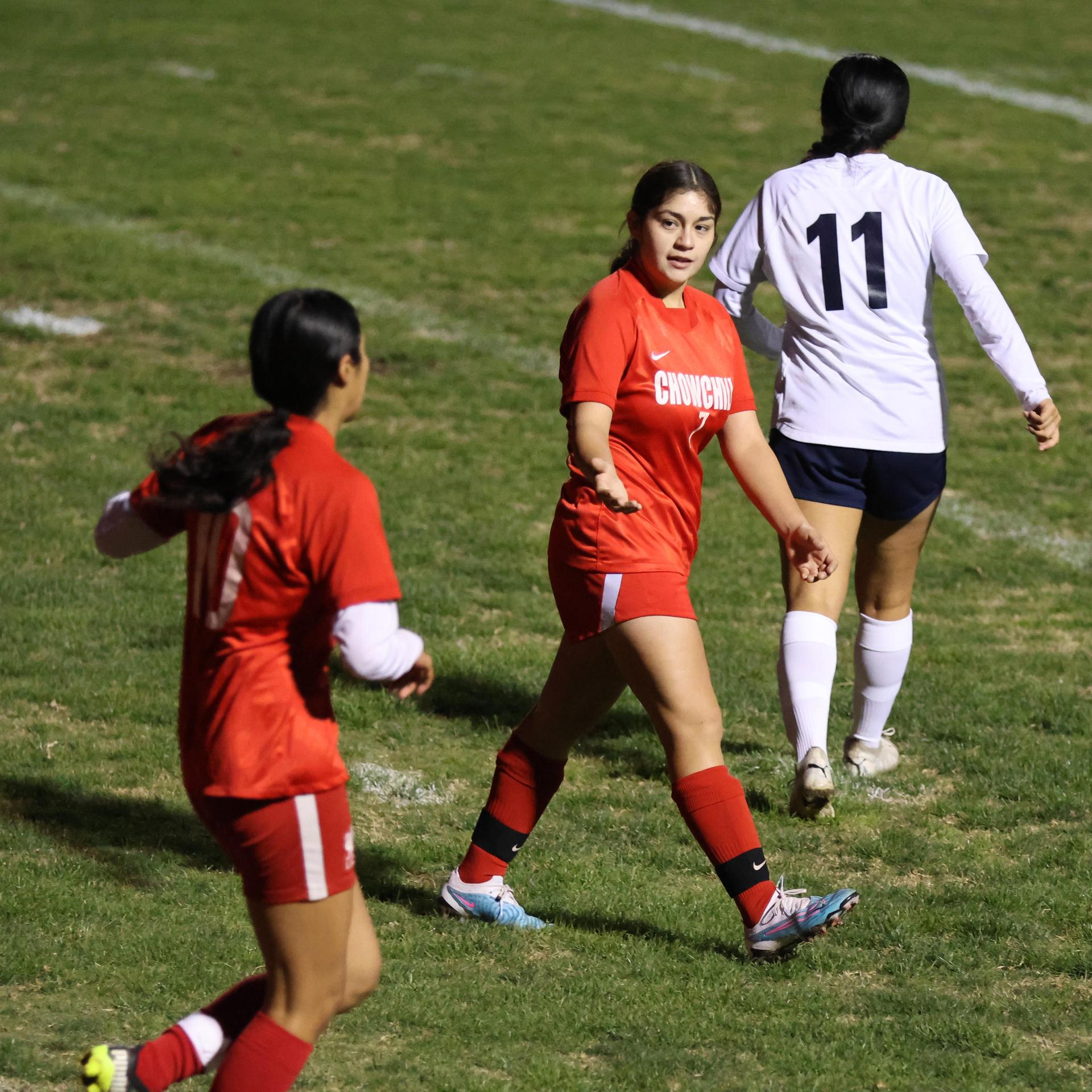Varsity girls playing soccer against sunnyside
