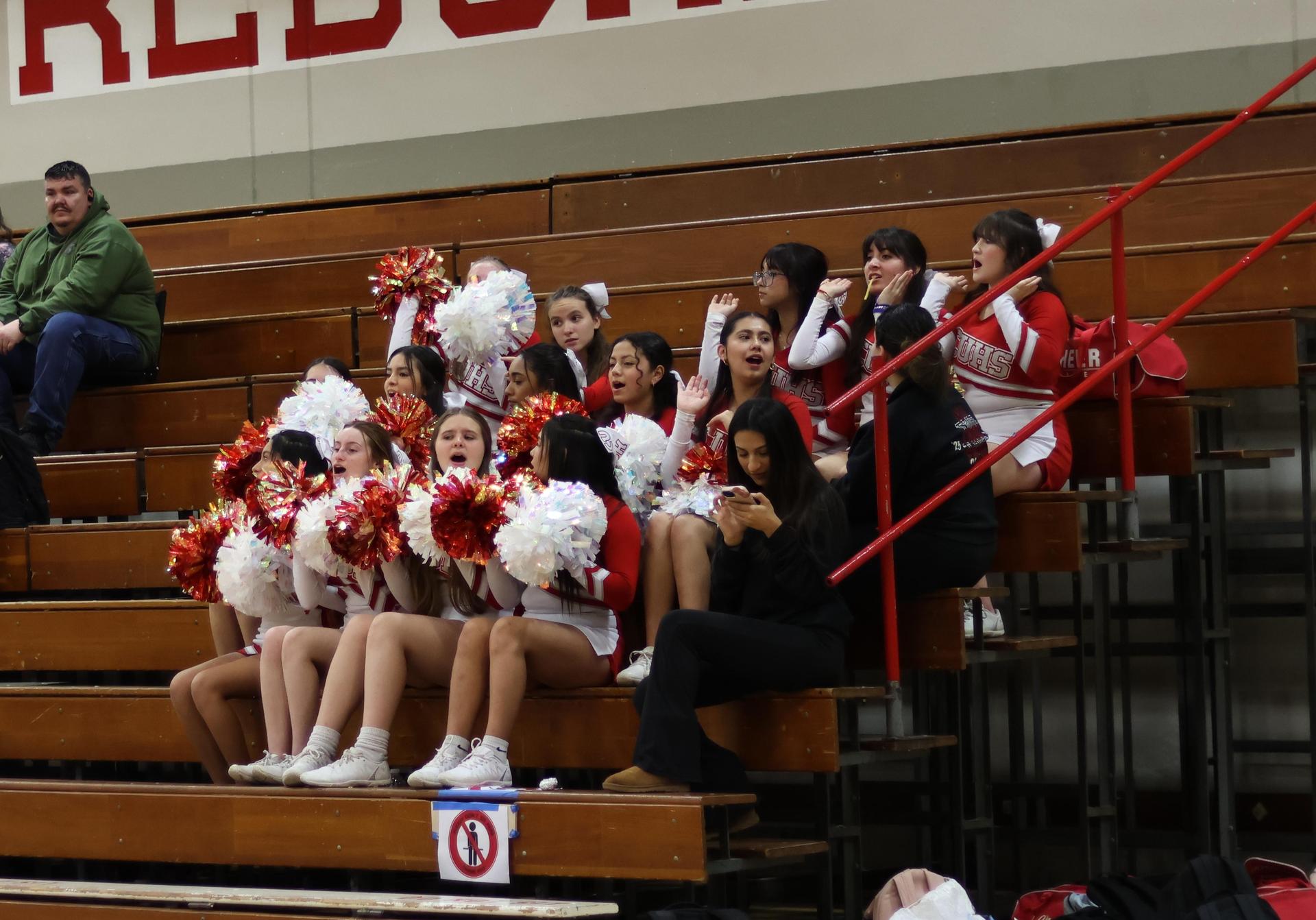 junior varsity cheerleaders cheering