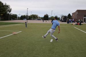 Dr. Thompson kicking soccer ball
