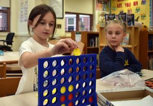 Students playing Connect Four