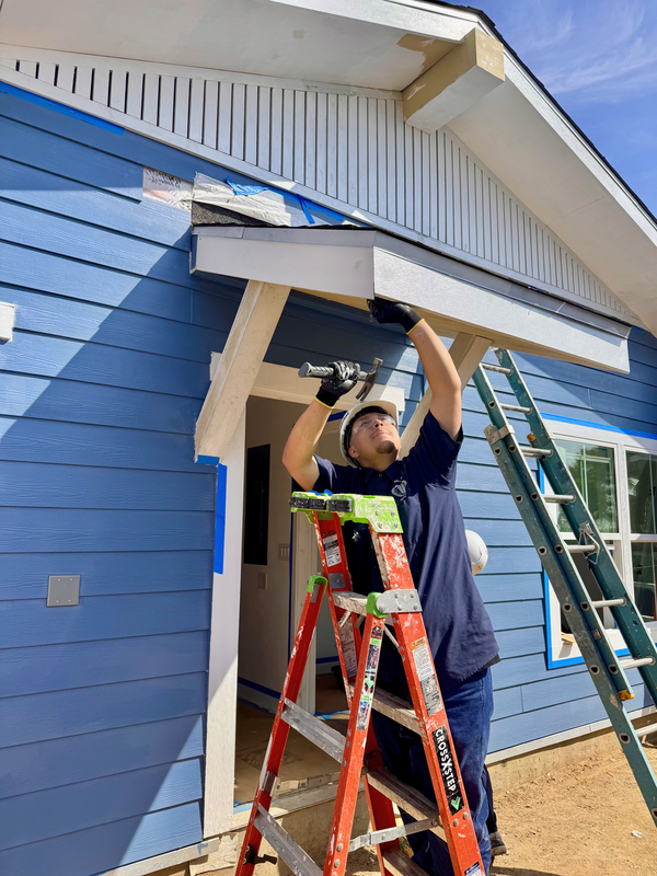 BPACE student Christopher Hernandez reinforces roof.