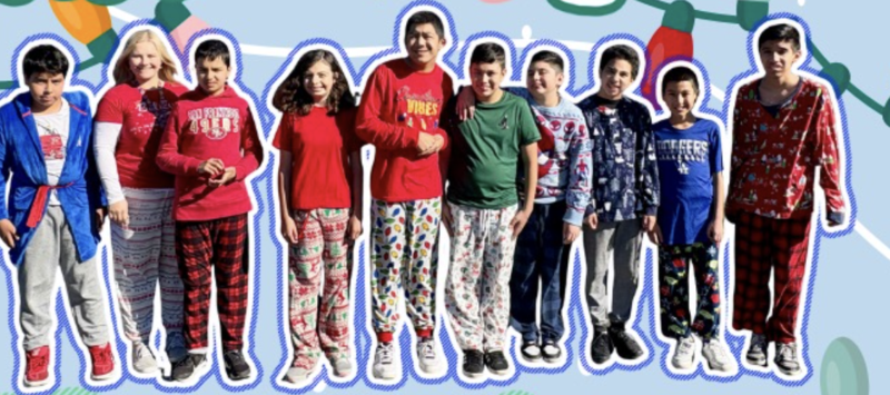 Group of over 20 students pose in pajamas