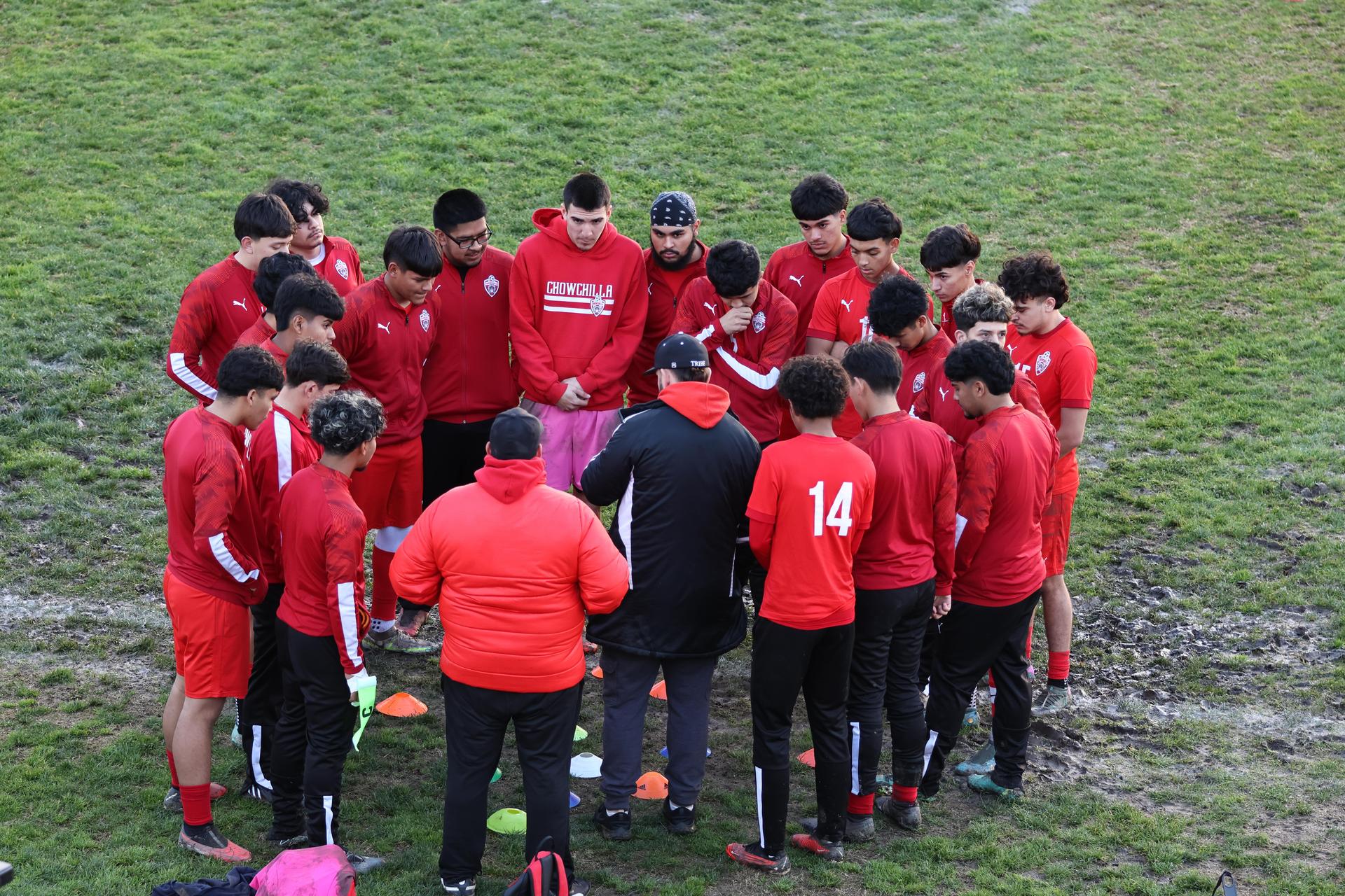 boys varsity soccer team players posing