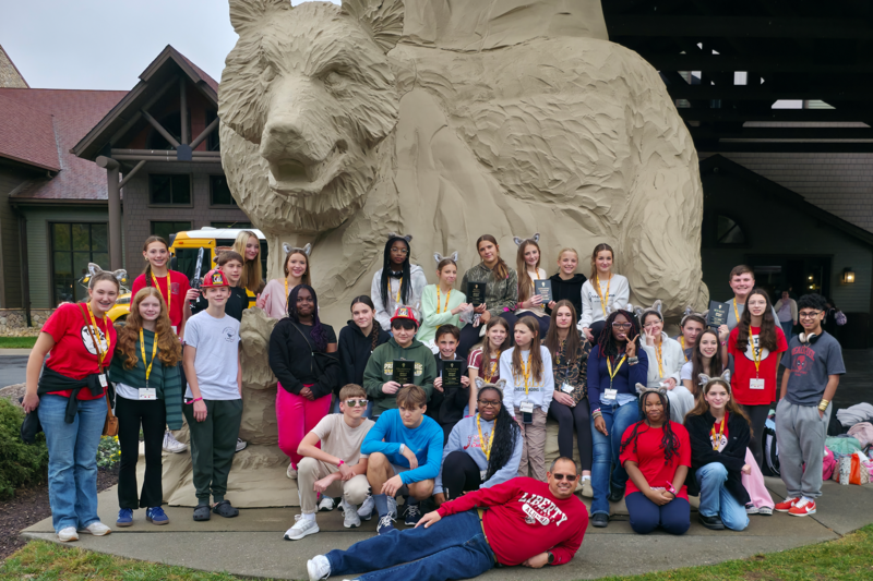 Students celebrate with a photo outside of Great Wolf Lodge in Williamsburg following the Leadership Summit.