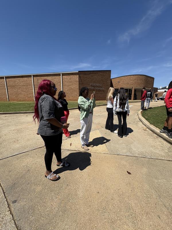 Students standing outside near the Annex