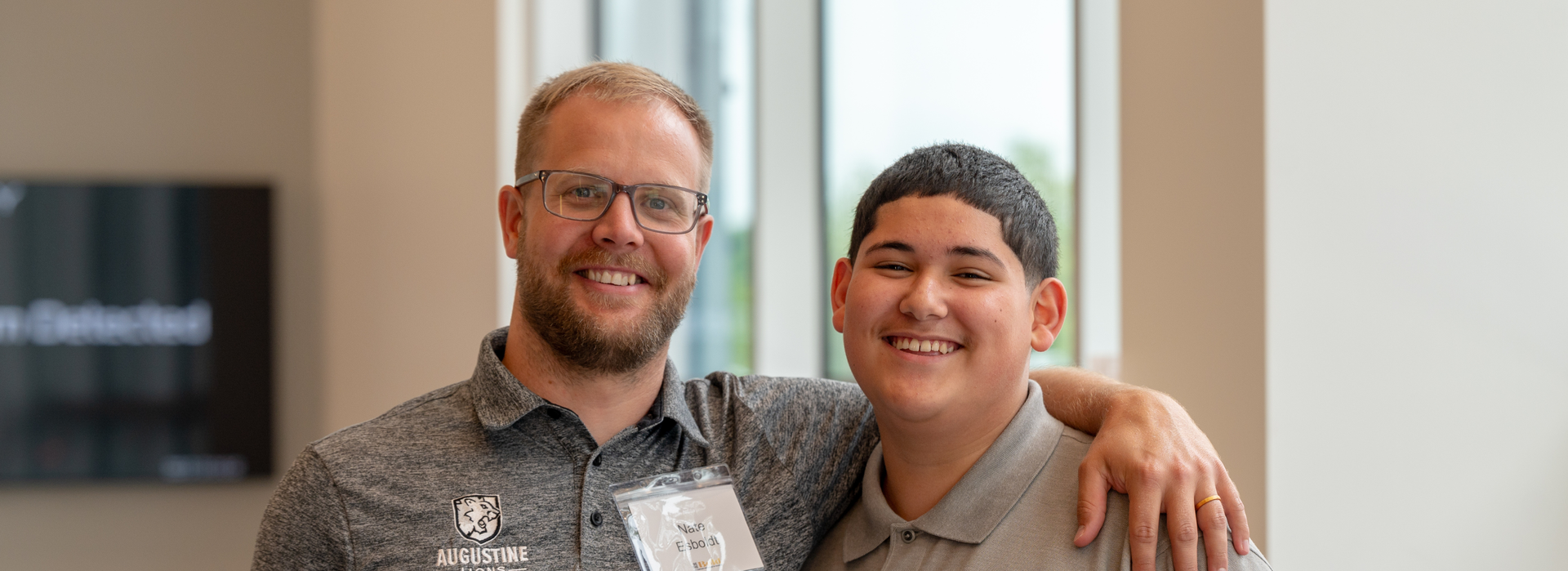 Staff and Student Smiling
