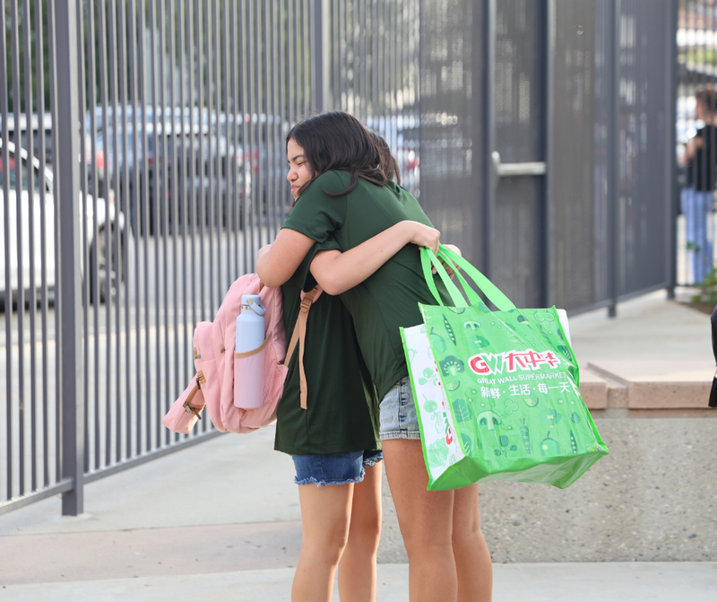 two students hugging
