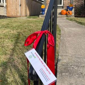 Photo of red ribbon on stair rail