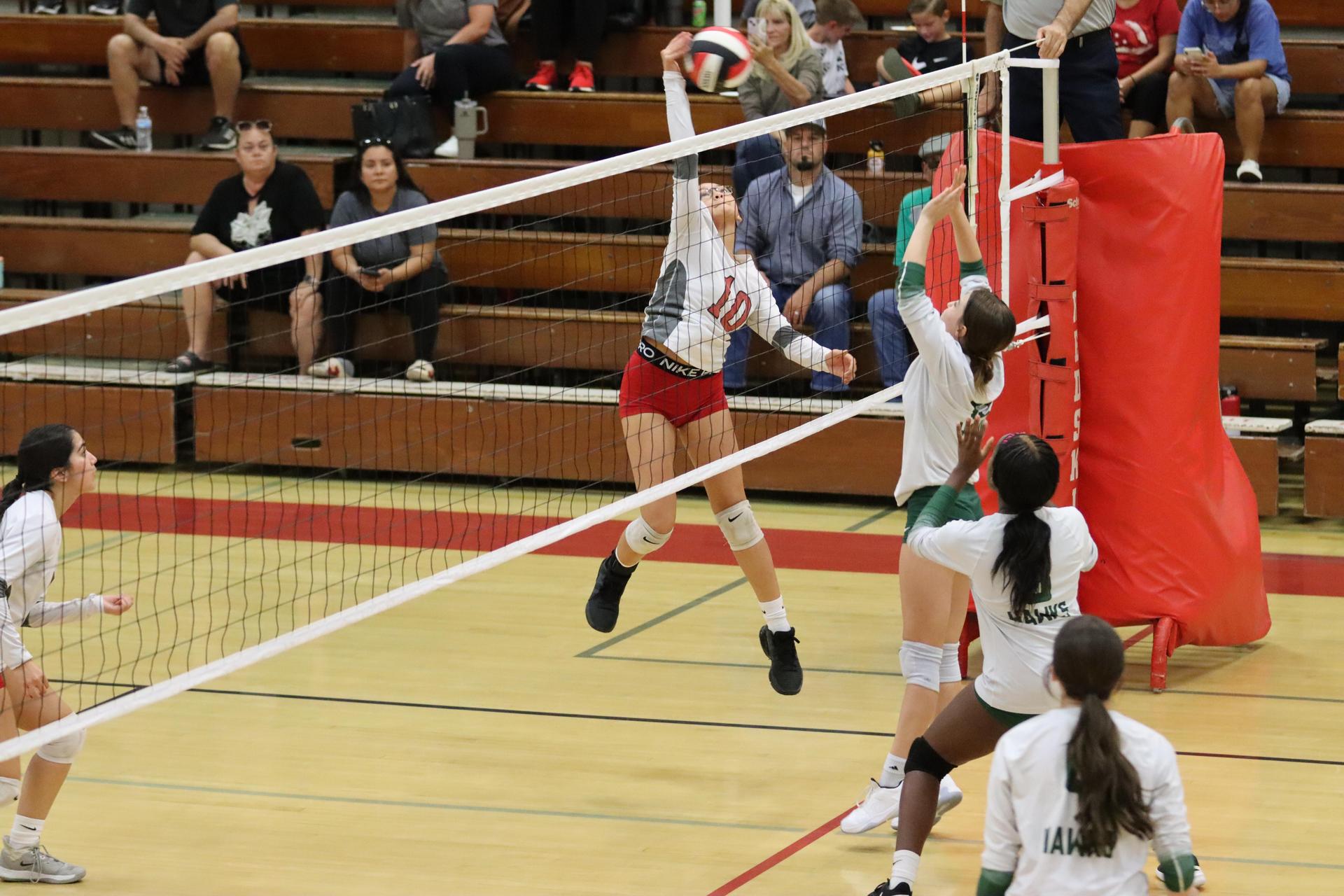 junior varsity girls playing volleyball against Liberty