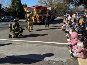 Two fire fighters in full gear