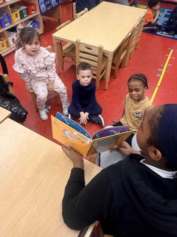 7th grader reads to younger students