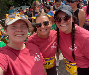 Three teachers in matching pink shirts at Colfax 5k