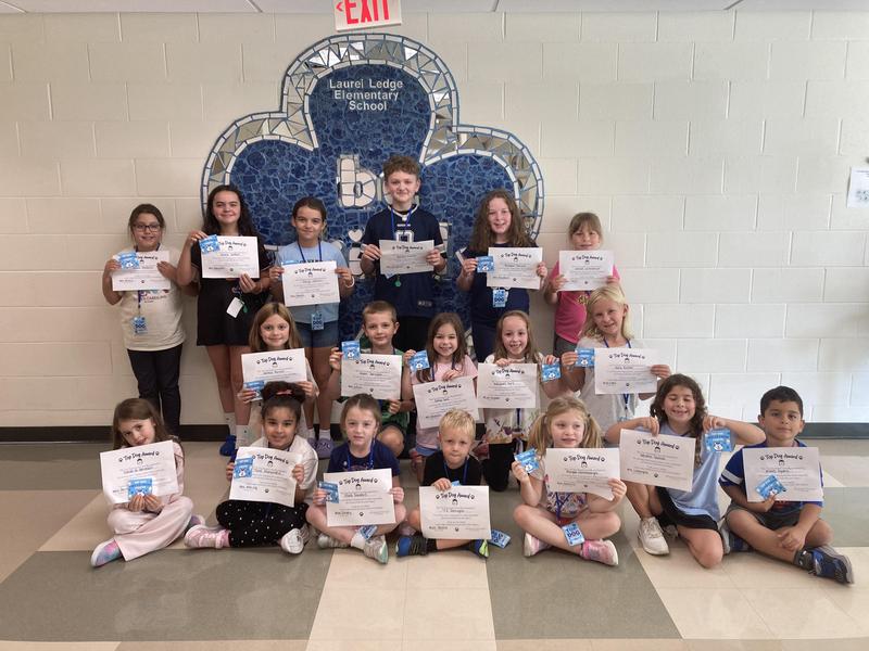 students who excelled and are showing off their top dog award