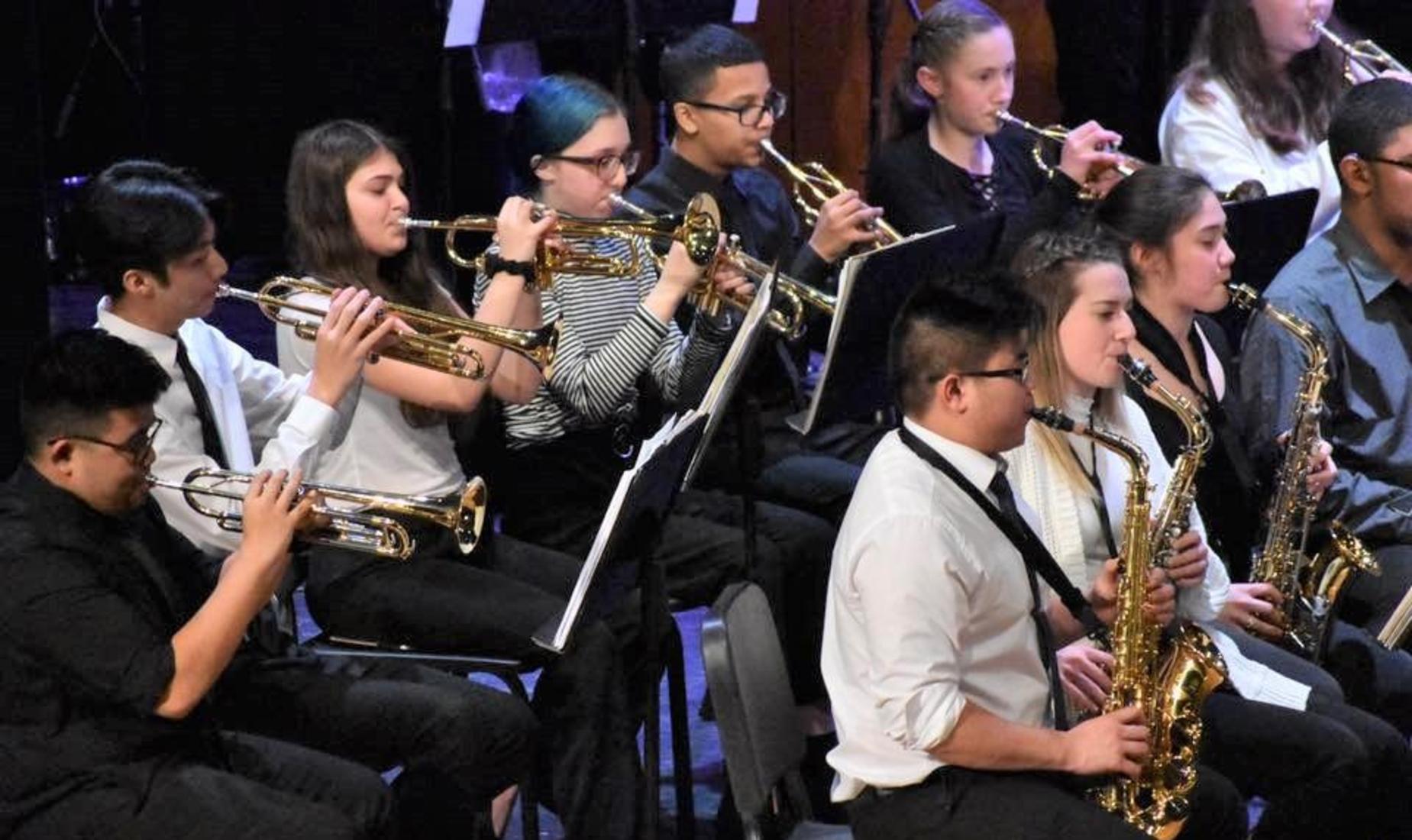 Boys and girls in the wind section performing at their spring concert